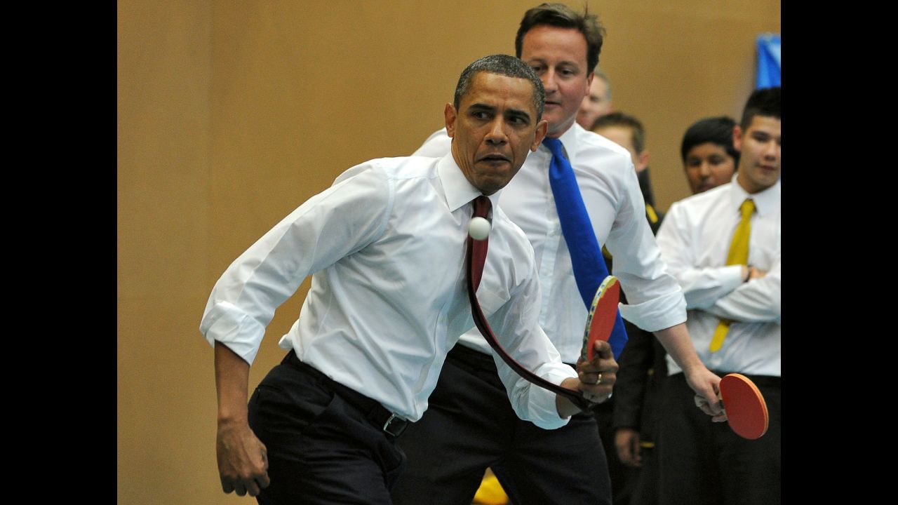 Obama and British Prime Minister David Cameron play table tennis with students in London on May 24, 2011.