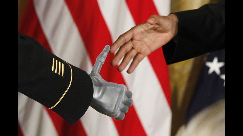 Obama shakes the prosthetic hand of Army Sgt. 1st Class Leroy Arthur Petry on July 12, 2011. Petry was at the White House <a href="index.php?page=&url=http%3A%2F%2Fwww.cnn.com%2F2011%2FPOLITICS%2F07%2F12%2Fmedal.of.honor%2F" target="_blank">to receive the Medal of Honor.</a> The Army Ranger lost his hand while tossing an enemy grenade away from fellow soldiers in Afghanistan.