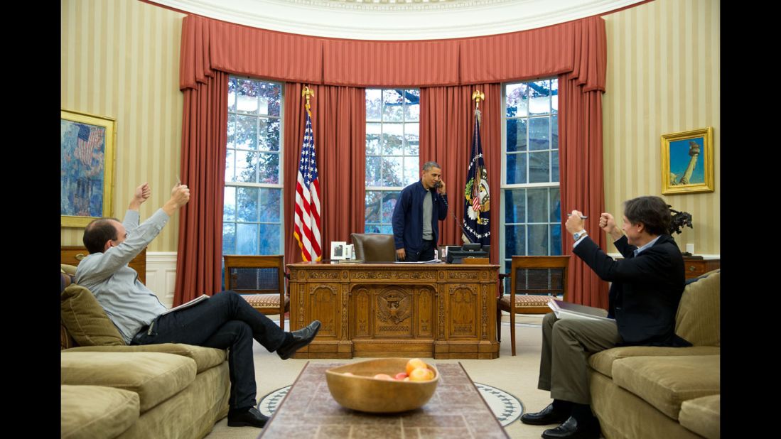 Advisers Ben Rhodes, left, and Tony Blinken show their approval as Obama discusses Iran negotiations with Secretary of State John Kerry on November 23, 2013. Two years later, after arduous talks that spanned 20 months, negotiators <a href="http://www.cnn.com/2015/07/14/politics/iran-nuclear-deal/index.html" target="_blank">reached a landmark deal</a> aimed at reining in Iran's nuclear program. The essential idea behind the deal is that in exchange for limits on its nuclear activities, Iran would get relief from sanctions while being allowed to continue its atomic program for peaceful purposes.