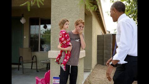 Obama greets locals in Phoenix after touring a model home of a nonprofit's housing development on January 8, 2014.