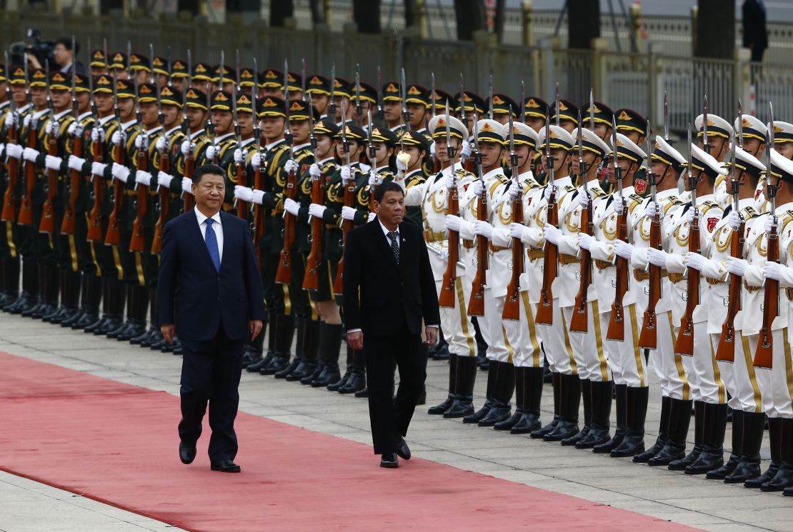 President of the Philippines Rodrigo Duterte and Chinese President Xi Jinping review the honor guard as they attend a welcoming ceremony at the Great Hall of the People on October 20, 2016 in Beijing, China.