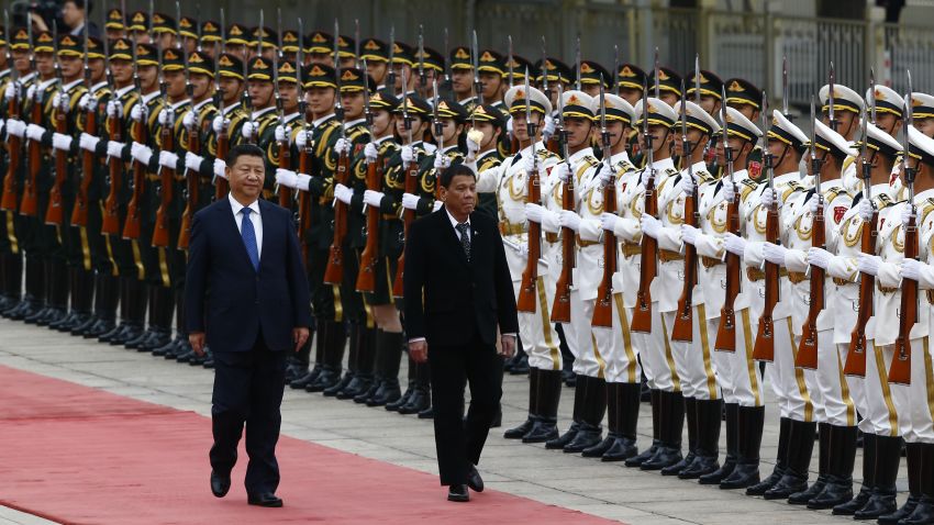 BEIJING, CHINA - OCTOBER 20: President of the Philippines Rodrigo Duterte and Chinese President Xi Jinping review the honor guard as they attend a welcoming ceremony at the Great Hall of the People on October 20, 2016 in Beijing, China. Philippine President Rodrigo Duterte is on a four-day state visit to China, his first since taking power in late June, with the aim of improving bilateral relations.  (Photo by Thomas Peter-Pool/Getty Images)