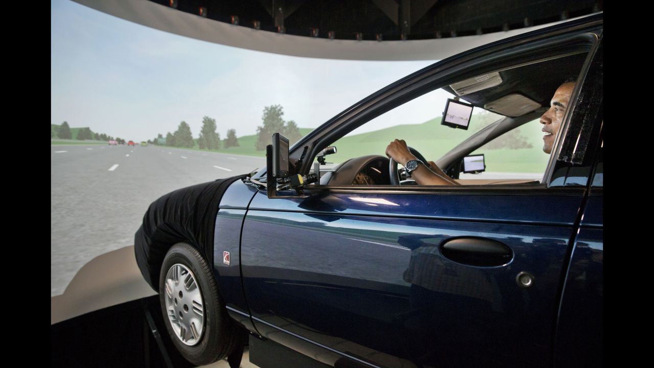 Obama tries out a driving simulator July 15, 2014, as he tours the Turner-Fairbank Highway Research Center in McLean, Virginia. The simulator was meant to demonstrate the types of "smart" vehicles being developed at the center.