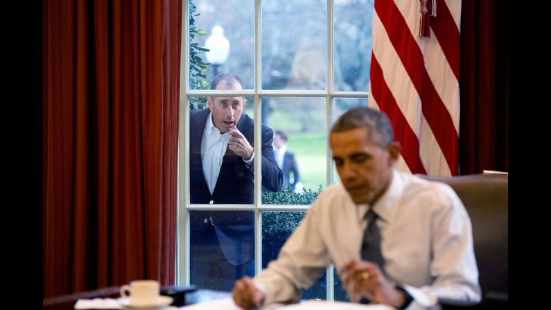 Comedian Jerry Seinfeld knocks on the Oval Office window December 7, 2015, during a taping of his series "Comedians in Cars Getting Coffee." The two <a href="index.php?page=&url=http%3A%2F%2Fwww.cnn.com%2F2015%2F12%2F31%2Fpolitics%2Fbarack-obama-jerry-seinfeld-comedians-in-cars-getting-coffee%2F" target="_blank">drove around the White House</a> in a 1963 Corvette Stingray, drank coffee and talked politics in the episode.