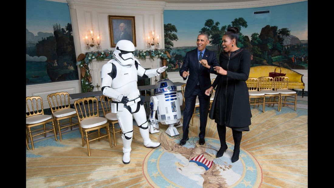 The President and the first lady meet R2-D2 and a stormtrooper for a White House screening of the new "Star Wars" movie on December 18, 2015.