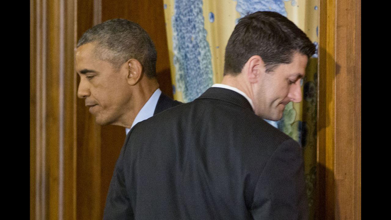 Obama walks past House Speaker Paul Ryan in Washington during a St. Patrick's Day lunch with Irish Prime Minister Enda Kenny on March 15, 2016.
