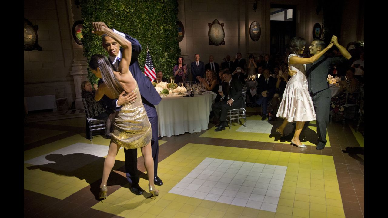 Obama, left, and first lady Michelle Obama, right, tango with dancers during a state dinner in Buenos Aires on March 23, 2016.
