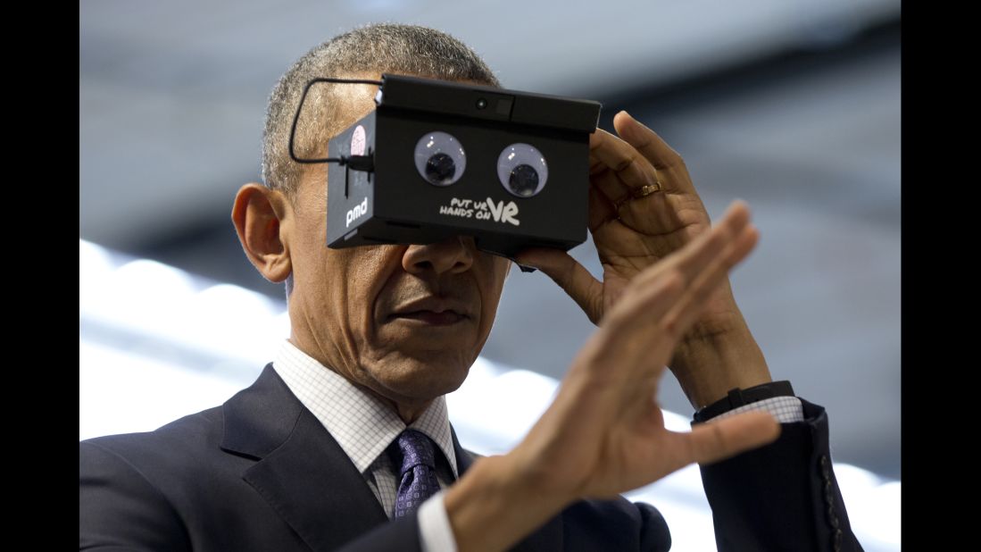 Obama tests virtual-reality goggles during a trade fair in Hanover, Germany, on April 25, 2016.