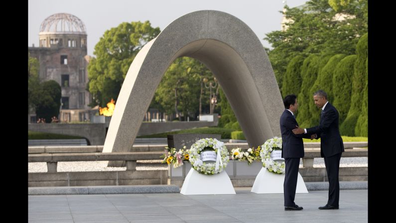 Obama and Japanese Prime Minister Shinzo Abe shake hands after laying wreaths at the Hiroshima Peace Memorial Park in Hiroshima, Japan, on May 27, 2016. <a href="index.php?page=&url=http%3A%2F%2Fwww.cnn.com%2F2016%2F05%2F27%2Fpolitics%2Fobama-hiroshima-japan%2F" target="_blank">Obama, the first sitting U.S. President to visit Hiroshima,</a> called for a "world without nuclear weapons" during his speech.