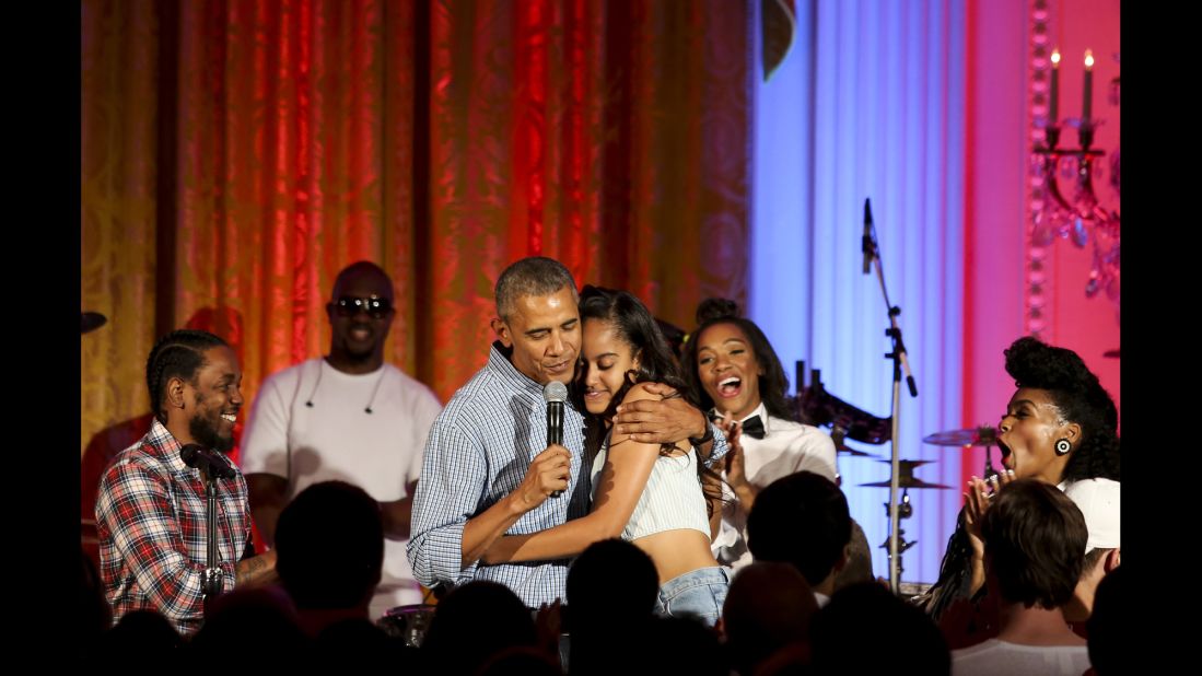Obama hugs his daughter Malia at the White House Fourth of July party in 2016. She was celebrating her 18th birthday during the party, which included musicians Janelle Monae and Kendrick Lamar.
