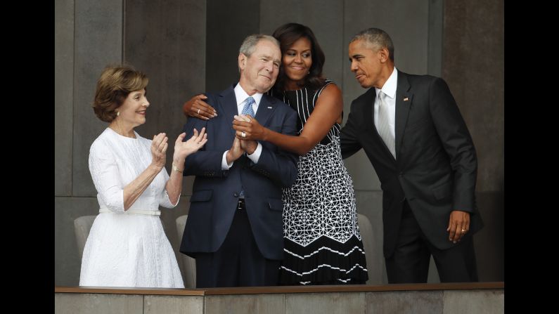 First lady Michelle Obama hugs former U.S. President George W. Bush during <a href="index.php?page=&url=http%3A%2F%2Fwww.cnn.com%2F2016%2F09%2F23%2Fpolitics%2Fsmithsonian-african-american-museum-obama%2F" target="_blank">the dedication ceremony</a> of the new Smithsonian museum devoted to African-American history. The museum opened in Washington on September 24, 2016. <a href="index.php?page=&url=http%3A%2F%2Fwww.cnn.com%2F2016%2F09%2F24%2Fpolitics%2Fmichelle-obama-george-w-bush-friendship%2F" target="_blank">Read more: The friendship of Michelle Obama and George W. Bush</a>
