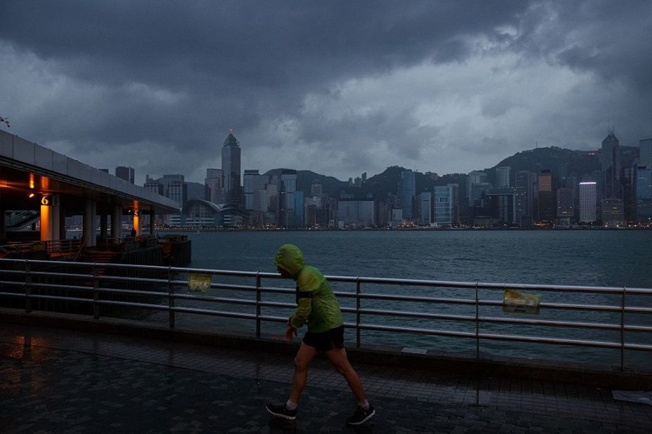 A runner braves the weather shortly after the T8 typhoon warning signal was raised.