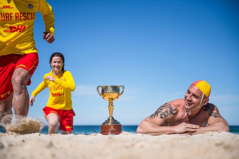 Surf lifesaver Luke Wilson with the Cup on the famous Bondi Beach in Sydney, New South Wales.