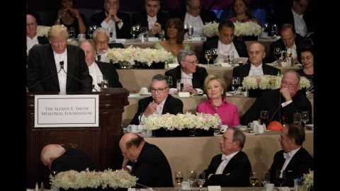 Democratic presidential nominee Hillary Clinton listens to her Republican opponent, Donald Trump, speak at <a href="http://www.cnn.com/2016/10/20/politics/al-smith-dinner-hillary-clinton-donald-tump/index.html" target="_blank">the Al Smith charity dinner</a> in New York on Thursday, October 20. The annual event benefits Catholic charities and is often one of the final opportunities for presidential candidates to share a stage before the election. Historically, it has been a good-natured roast -- but CNN's Stephen Collinson said <a href="http://www.cnn.com/2016/10/21/politics/al-smith-dinner-hillary-clinton-donald-trump-campaign/index.html" target="_blank">Clinton and Trump struggled to disguise the anger, bitterness and sheer open dislike</a> that has pulsed through the race.