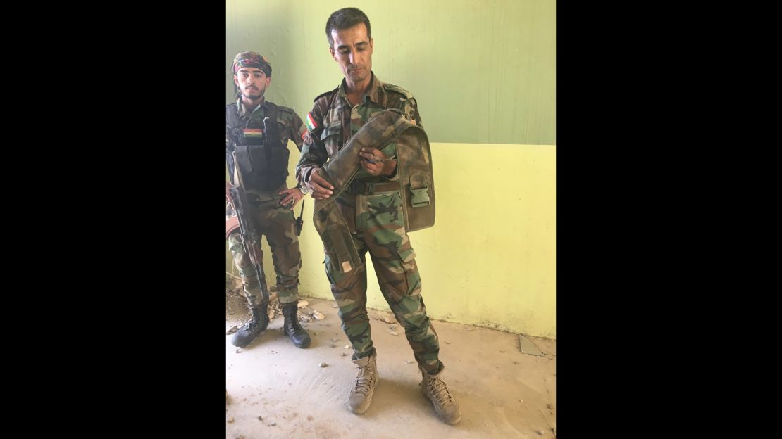 Captain Chilhan Sadk with an ISIS-made suicide belt he diffused.