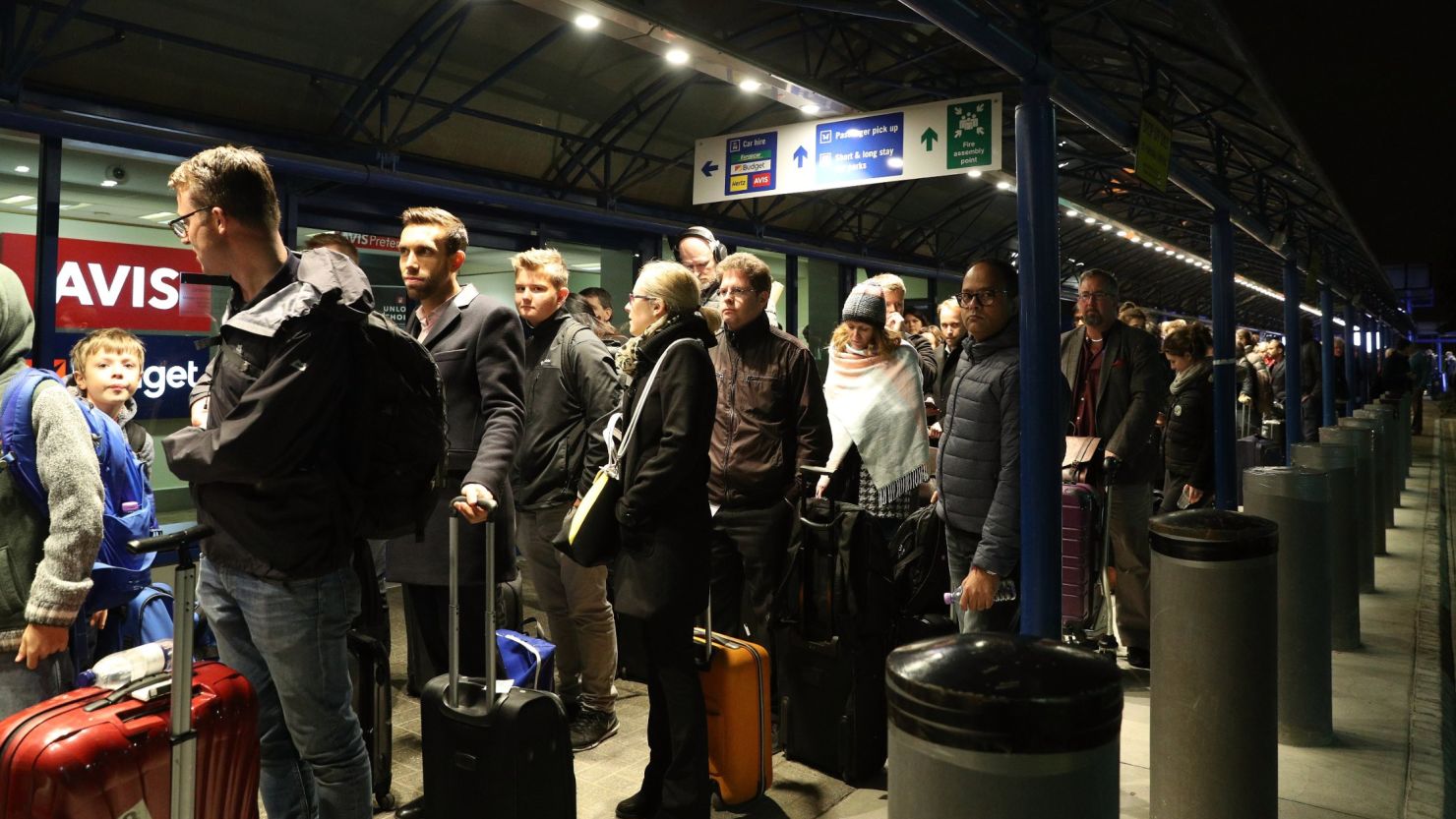 Passengers queued outside London City Airport after it was evacuated Friday.