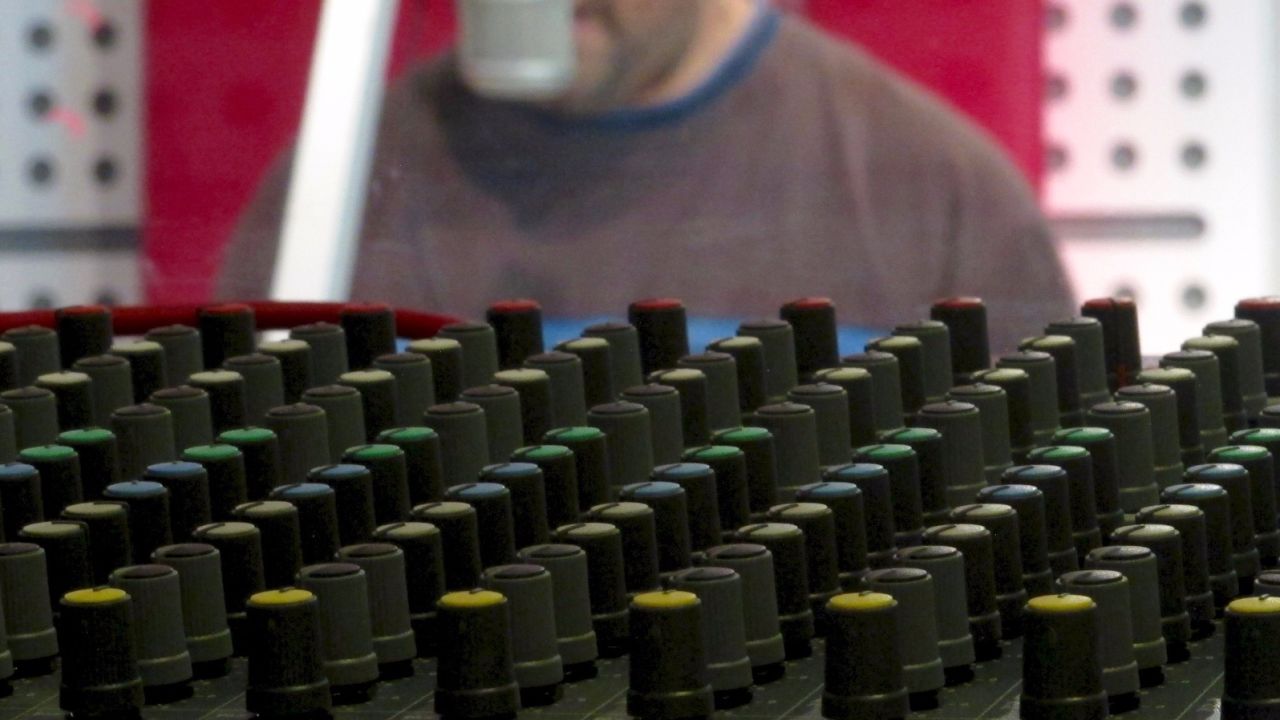 Mosul residents have to call in surrepitiously into the radio station since cell phones and the internet were banned by ISIS.