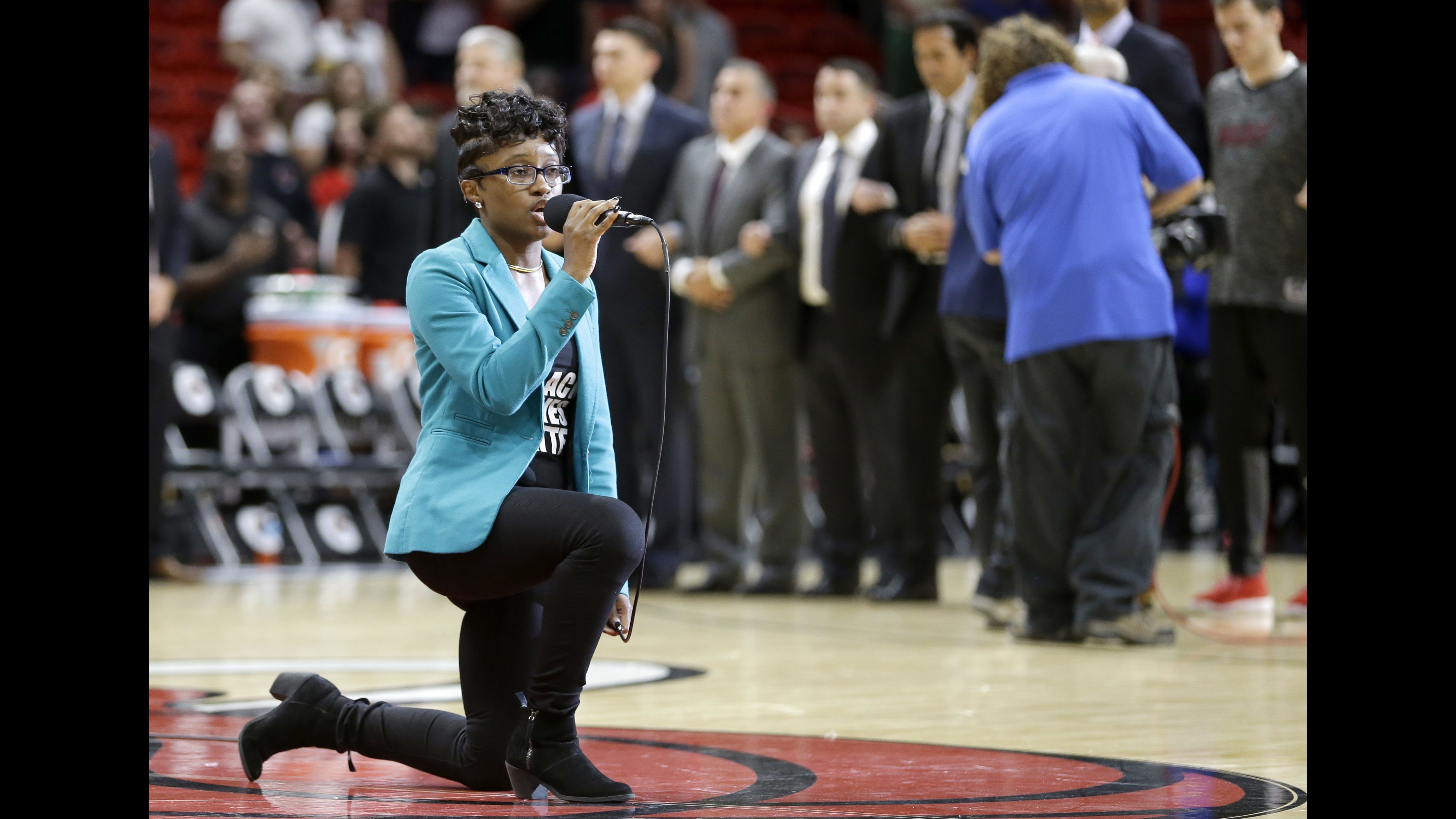 Denasia Lawrence performs the national anthem before an NBA preseason game Friday night in Miami. 