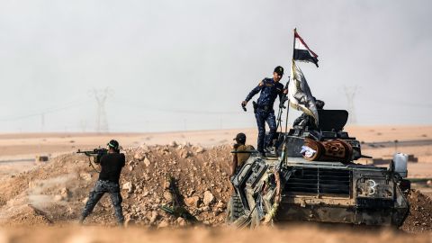 Iraqi pro-government forces hold a position south of Mosul on Friday.