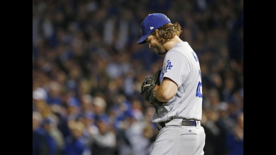 Los Angeles Dodgers starting pitcher Clayton Kershaw reacts after Chicago Cubs shortstop Addison Russell (27) hits a double during the second inning.