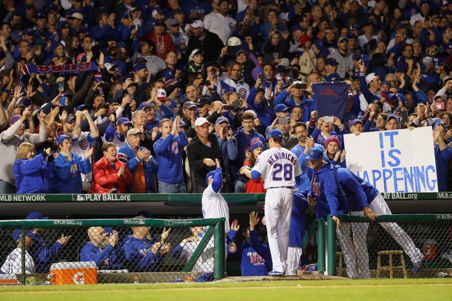 Cubs fans cheer as Kyle Hendricks is relieved in the eighth inning.