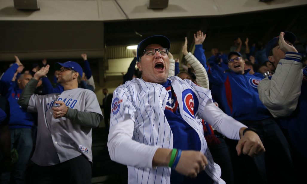 Chicago Cubs fan Jim Foste celebrates a Kris Bryant RBI single in the first inning against the Dodgers.