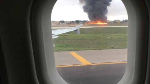 Ben Cundall says he could see the burning wreckage of the plane as he waited on a nearby flight.