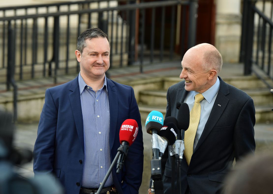 Gareth Lee, left, speaks outside Belfast high court Monday with Michael Wardlow of the Equality Commission.