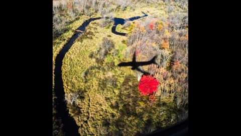 A shadow of Clinton's campaign plane is seen as the candidate prepares to land in Manchester, New Hampshire, on Monday, October 24.