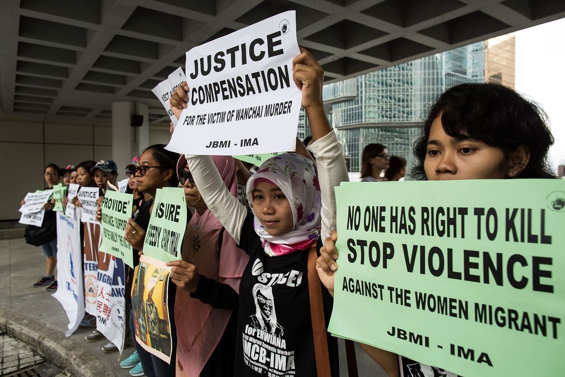 Members of Asian Migrants Coordinating Body (AMCB) protest outside the High Court on October 24, 2016 in Hong Kong.