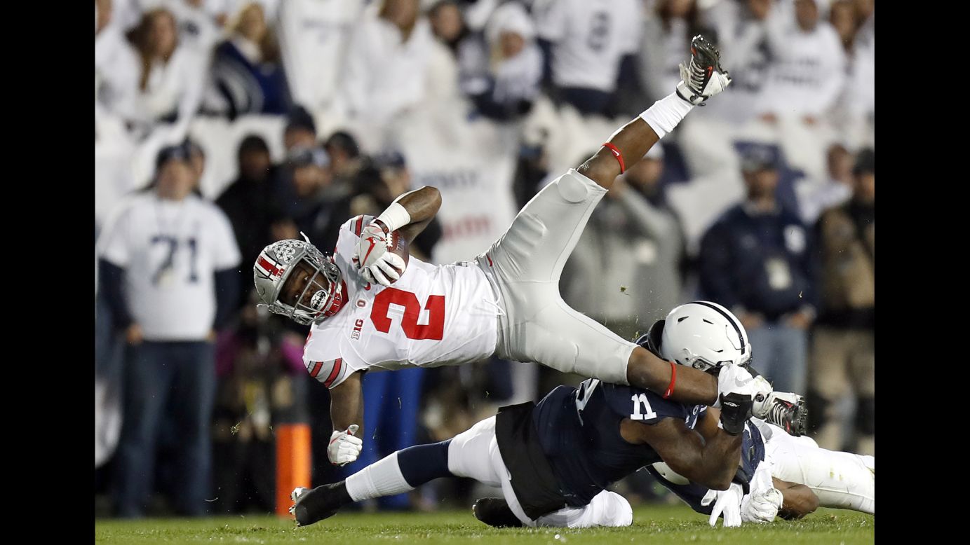 Penn State's Brandon Bell tackles Ohio State's Dontre Wilson during a college football game in State College, Pennsylvania, on Saturday, October 22. Penn State upset the No. 2 Buckeyes 24-21.