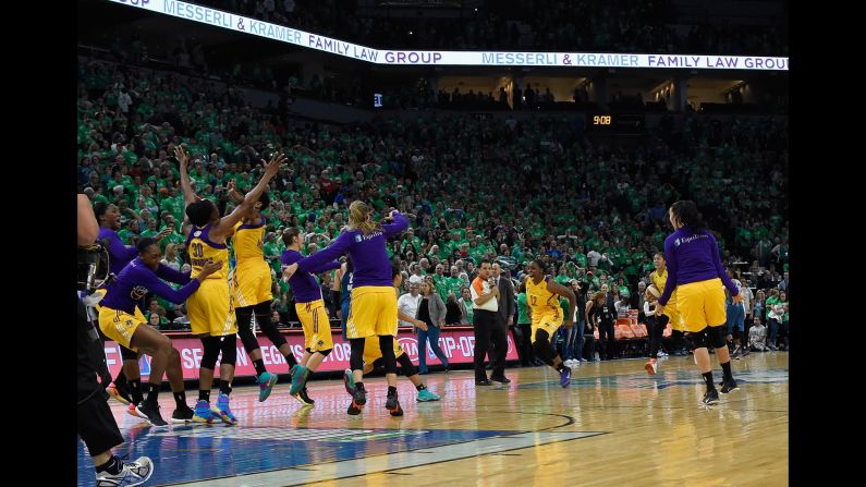 The Los Angeles Sparks celebrate after they won the WNBA title on Thursday, October 20. The Sparks defeated Minnesota 77-76 to win the best-of-five series 3-2. It is their first championship since 2002.