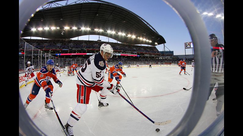 Winnipeg's Mark Schiefele plays the puck during the Heritage Classic, an NHL game played outdoors in Winnipeg, Manitoba, on Sunday, October 23.