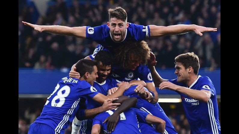 Chelsea players celebrate after N'Golo Kante's goal put the finishing touches on a 4-0 thrashing of Manchester United on Sunday, October 23. The London match was <a href="index.php?page=&url=http%3A%2F%2Fwww.cnn.com%2F2016%2F10%2F23%2Ffootball%2Ffootball-epl-man-utd-chelsea-mourinho%2Findex.html" target="_blank">a nightmare return for Jose Mourinho,</a> Chelsea's former manager who now leads United.