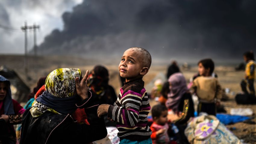 Iraqi families who were displaced by the ongoing operation by Iraqi forces against jihadistds of the Islamic State group to retake the city of Mosul, are seen gathering on an area near Qayyarah on October 24, 2016. 
The UN refugee agency is preparing to receive 150,000 Iraqis fleeing fighting around the Islamic State group-held city of Mosul within the next few days, its chief said.

 / AFP / BULENT KILIC        (Photo credit should read BULENT KILIC/AFP/Getty Images)