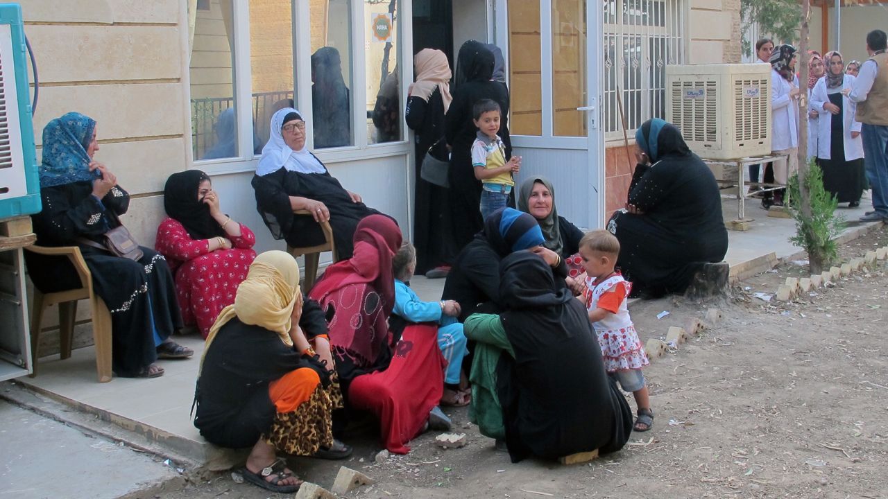 Women wait for their turn to see a doctor at a UN-funded clinic at the Debaga camp. Many have not received proper reproductive care and suffer from the trauma of abuse.