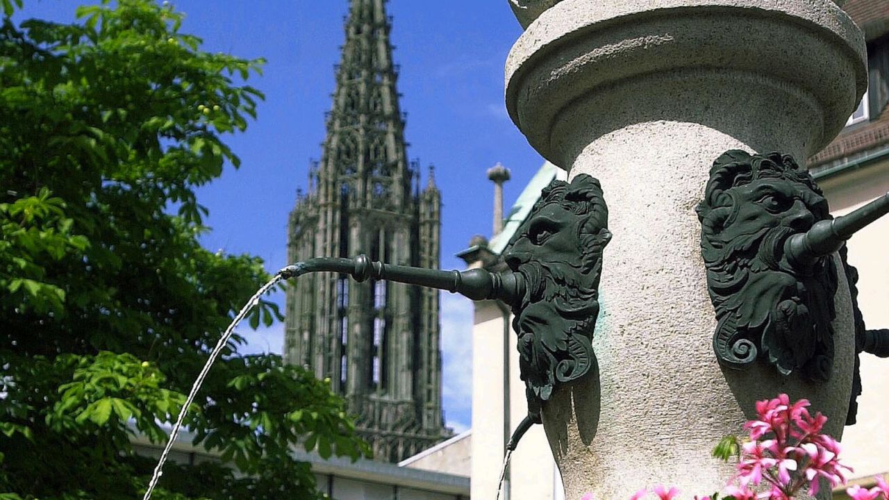 Ulm's Saint Christopher's fountain with Ulm Minster in background. 