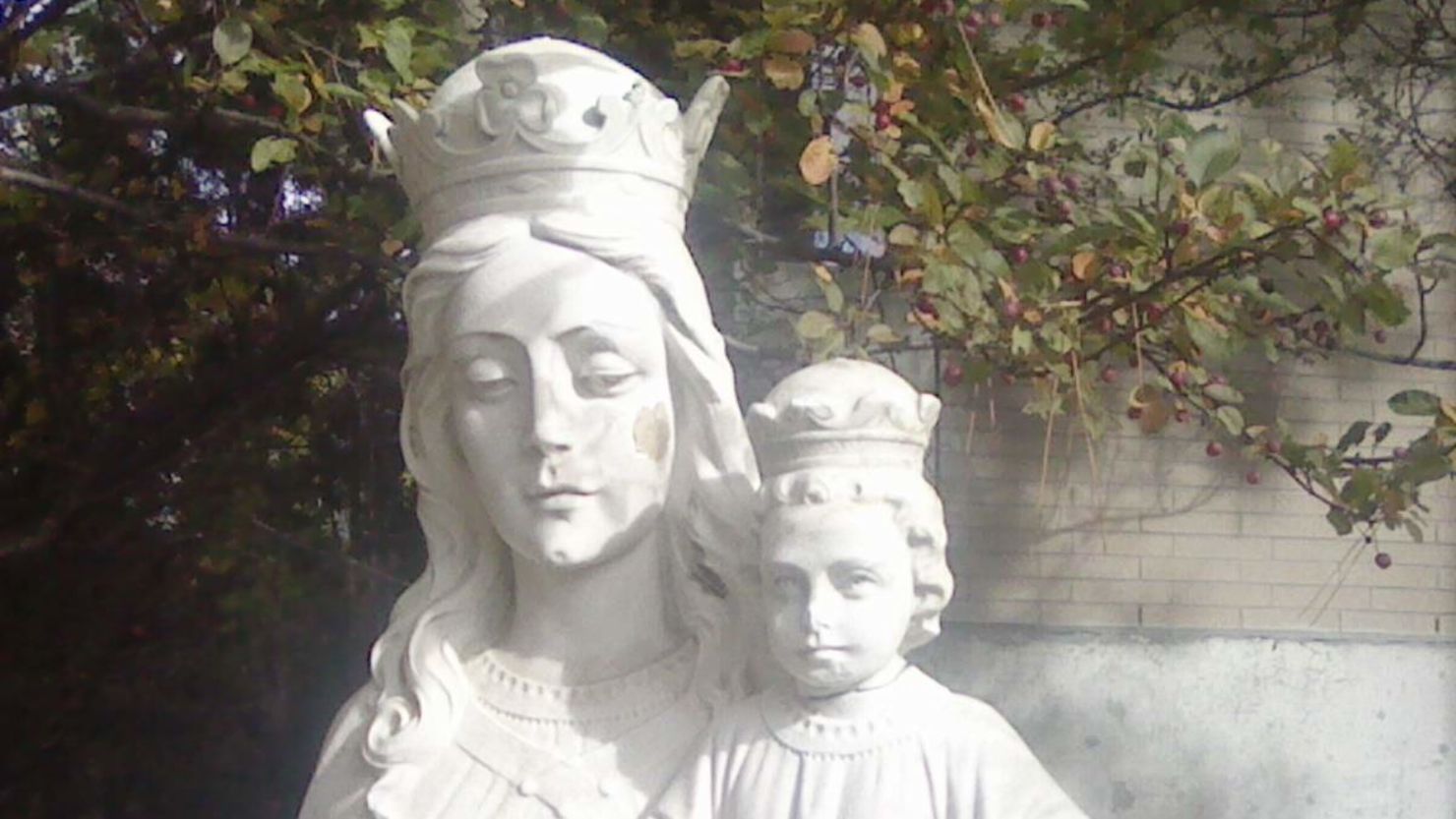 The original stone head of baby Jesus head sits atop the statue. A temporary head, crafted by a local artist, was earlier mocked on social media. The head "is now in a safe place until work is done," Father Gerald told CNN.