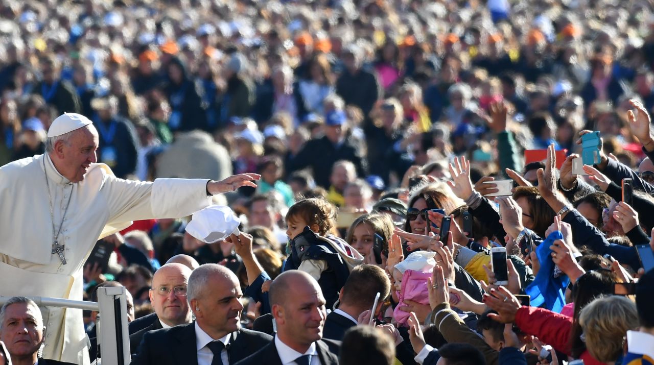 Pope Francis salutes the faithful upon his arrival in St. Peter's Square at the Vatican for the Special Jubilee Papal Audience on Saturday, October 22, 2016.