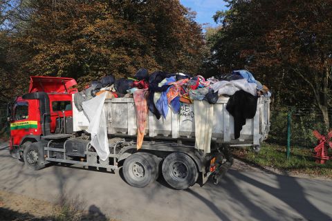 Migrants' belongings are trucked out of the "Jungle" on October 25.
