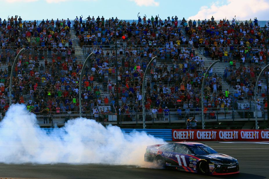 "What I love about racing really is the competition of it," says Hamlin. <br />Pictured here he celebrates his win at the NASCAR Sprint Cup Series Cheez-It 355 with a burnout in August 2016.