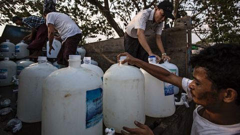 Volunteers prepare the clean water donation service in Dala, Burma.