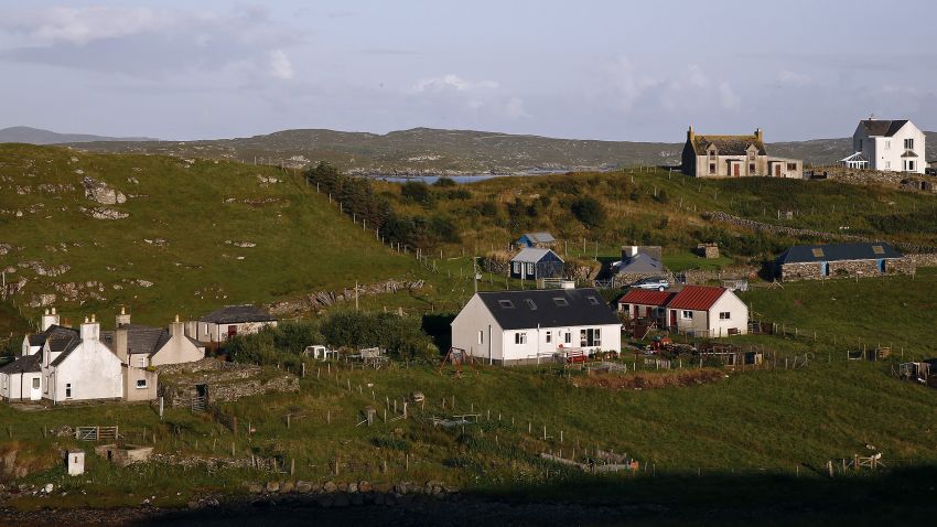 FILE PHOTO: Residential properties stand on the banks of East Loch Roug on the Isle of Lewis, U.K., on Thursday, Aug. 7, 2014. Scotlands nationalists suffered a second straight setback in the polls after YouGov Plc showed them trailing less than a week after overtaking the anti-independence campaign for the first time. Scottish residents vote in a referendum in less than a week on Sept. 18. Photographer: Simon Dawson/Bloomberg via Getty Images