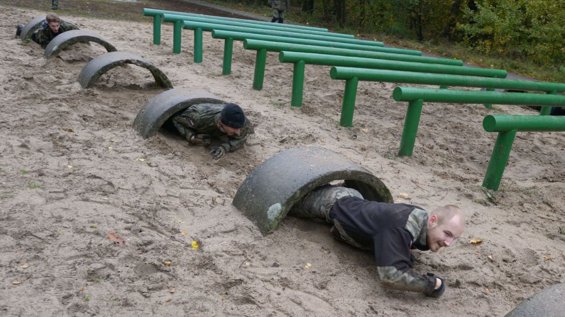 Recruits are submitted to military-style training on a course outside Warsaw.