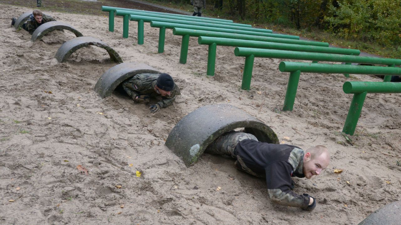 Recruits are submitted to military-style training on a course outside Warsaw.