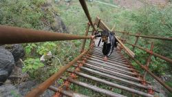 A mountain village on a cliff in southwestern China has been building a huge steel ladder to connect it to the outside world more securely, using more than 1,500 steel pipes. The village started to construct the ladder in August 2016 with an investment of 1 million yuan ($147,928) from local authorities. Situated at the top of a mountain in Liangshan Yi Autonomous Prefecture, Sichuan province, the isolated village of Atulieer is perched nearly 1,000 meters above the valley floor and villagers need to climb 17 rattan ladders to reach their homes. The construction would require more than 1,500 steel pipes with a diameter of 5cm as guardrails and steps, a village official was quoted as saying.    Photo by Imaginechina