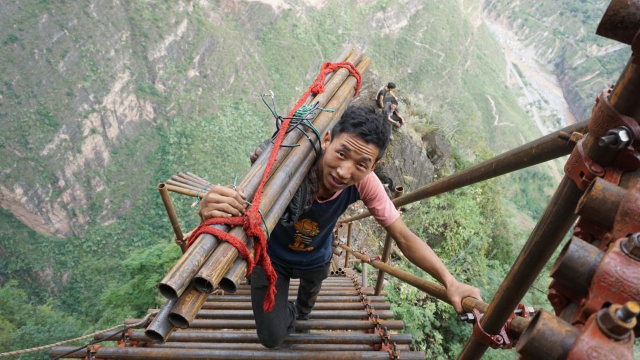 A mountain village on a cliff in southwestern China has been building a huge steel ladder to connect it to the outside world.