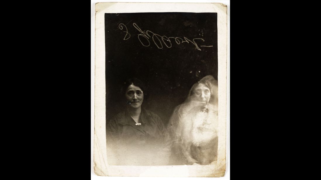The face of a young woman appears over a woman on the right. One of the people in the photograph signed the plate for authentication.