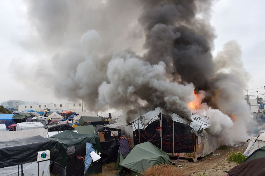 Migrants torched temporary shelters at The Jungle on Wednesday, authorities said. 