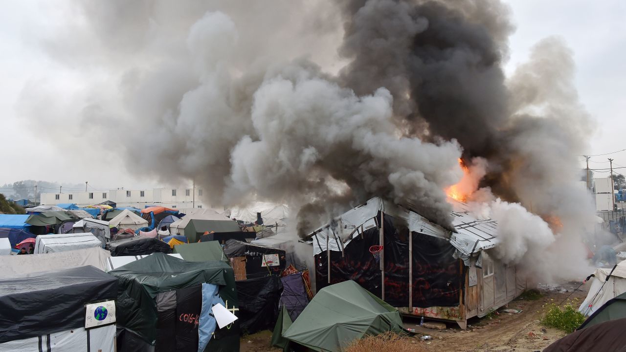 Migrants torched temporary shelters at The Jungle on Wednesday, authorities said. 